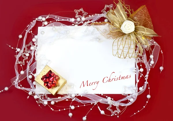 Christmas card with decoration on red background — Stock Photo, Image