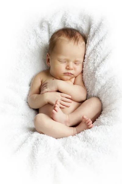 Newborn baby sleeping on a white blanket — Stock Photo, Image