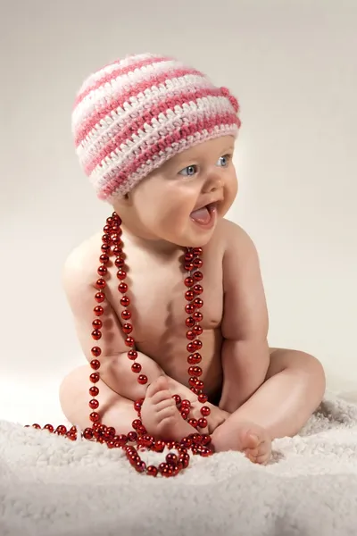Baby with beads — Stock Photo, Image