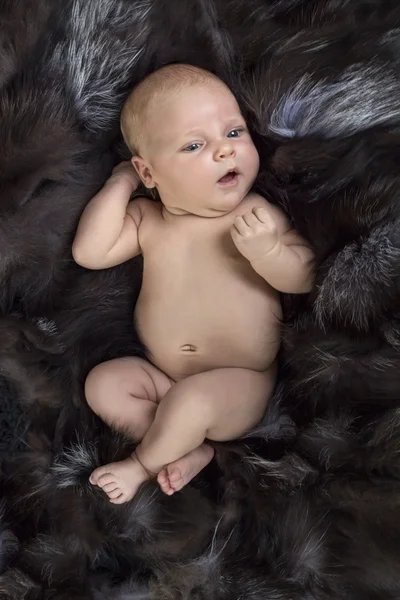 Newborn baby on fur — Stock Photo, Image