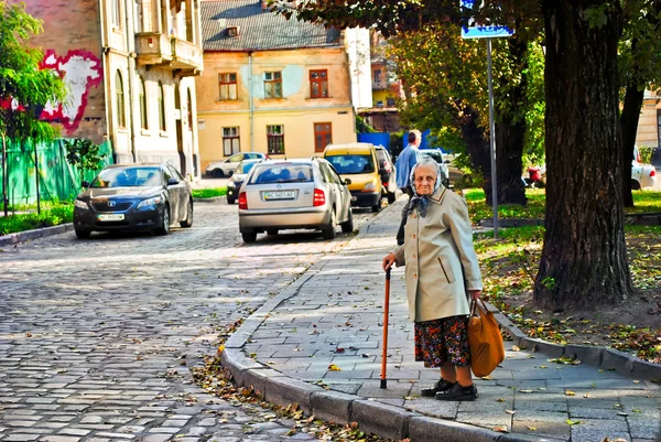 Photo of Elderly woman in street city — Stock Photo, Image