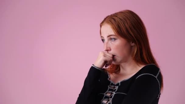 Video Upset Girl Who Nervous Bites Her Nails Pink Background — Stock Video