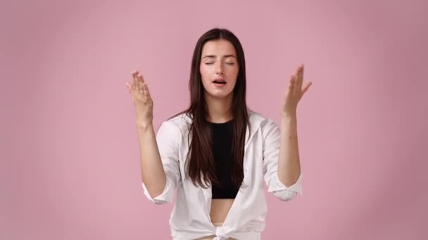 Video Smiling Female Waving Her Hands Pink Background Concept Waving — Stock Video