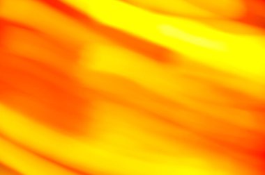Sarı turuncu rengin pürüzsüz bulanık arkaplanı hareket halinde.