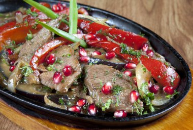 Beef Stew in a slow-cooker, ready to serve. cooked with pomegran