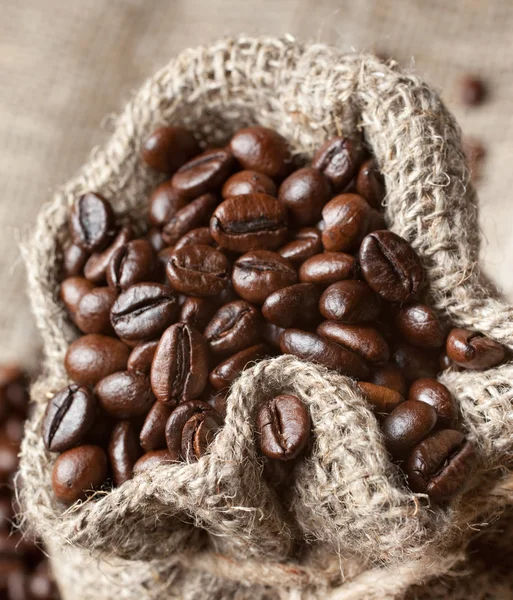 Coffee beans in burlap bag — Stock Photo, Image