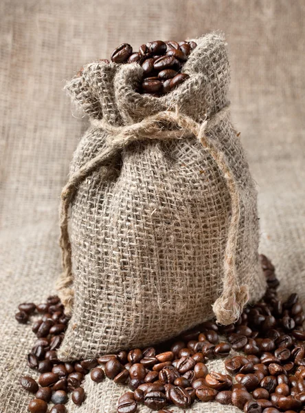 Coffee beans in burlap bag — Stock Photo, Image