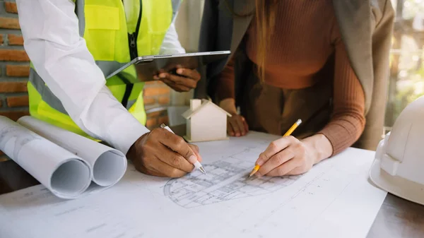 Engineer teamwork. Image of engineer meeting for architectural project. working with partner and engineering tools on workplace