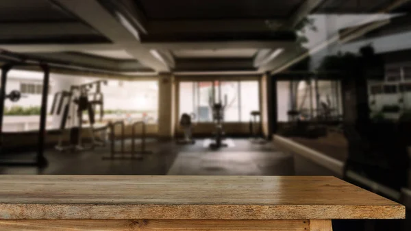 fitness gym and wooden table space in morning ligh