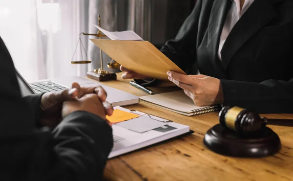 lawyer at desk working on meeting with client