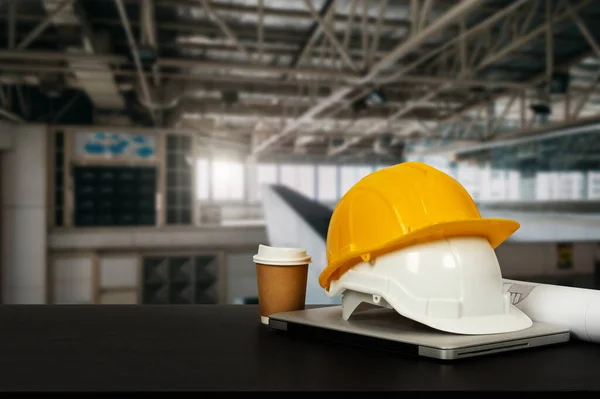 building construction helmets and coffee mug