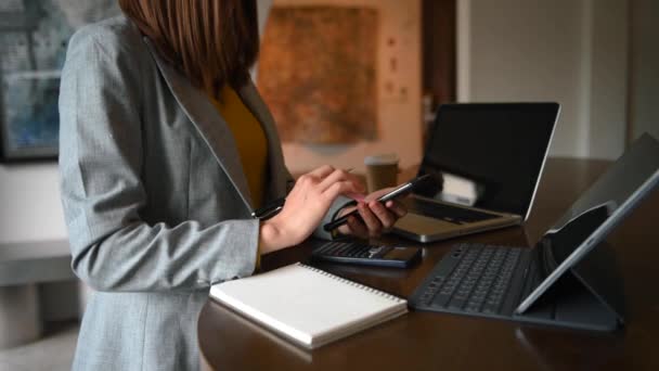 Businesswoman Using Mobile Phone Desk Laptop — Vídeos de Stock