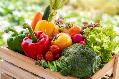 Wooden box filled with fresh organic vegetables