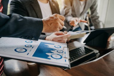 Business documents in office, business people brainstorming at desk 