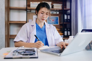 Medical technology concept. Doctor working with note and stethoscope in modern office