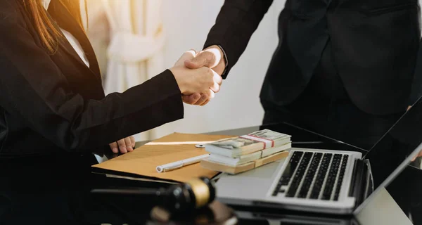 Lawyer and client shaking hands, lawyer service concept