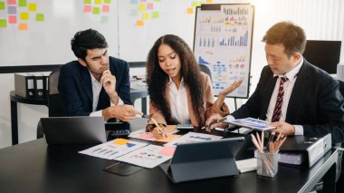  Young business creative team are brainstorming planning discussing while sitting in creative business discussing work in the modern office