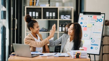 Show me the joy hi five hands.  businesswomen executives celebrating the success of the company