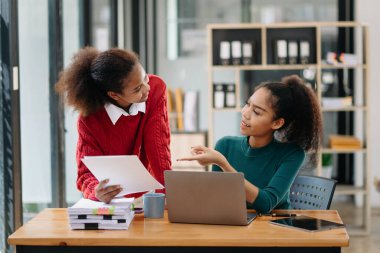 Kind leader executive manager share and discuss business solutions plan ideas on tablet with female marketing manager office.