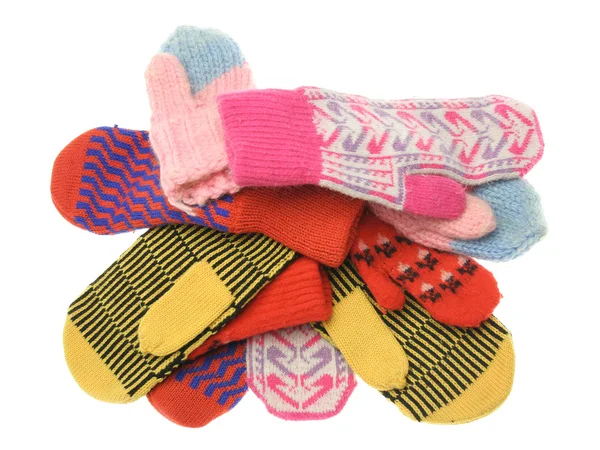 Heap of multicoloured wool mittens — Stock Photo, Image