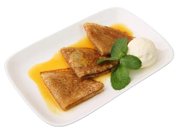 Pancakes in orange sauce with ice cream — Stock Photo, Image