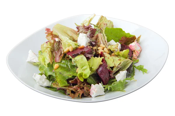 Salad of roasted beets with goat cheese and pine nuts — Stock Photo, Image