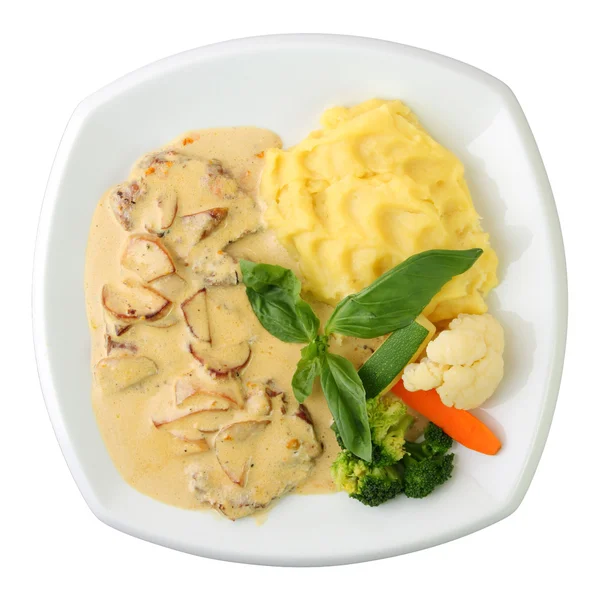 Veal in a creamy sauce with mushrooms and garnish — Stock Photo, Image