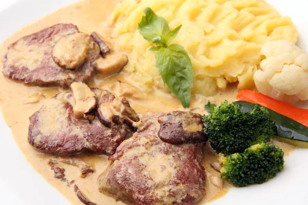 Veal in a creamy sauce with mushrooms — Stock Photo, Image