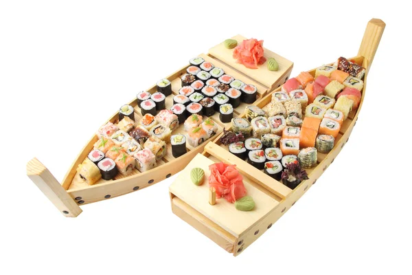 Wooden ships with rolls and sushi — Stock Photo, Image