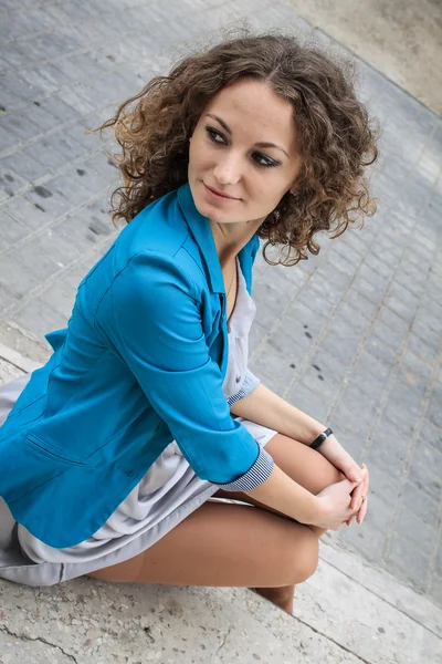 Beautiful curly girl in old city — Stock Photo, Image