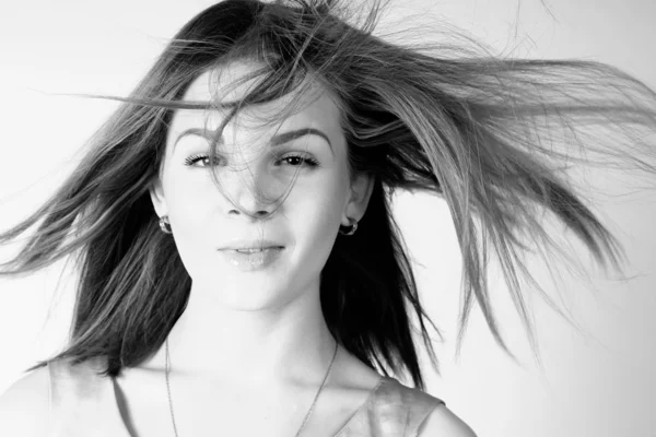 Portrait of beautiful girl with long hair blowing in breeze — Stock Photo, Image