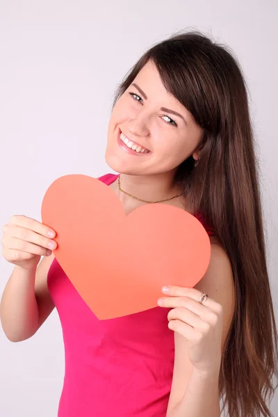 Girl with a heart shape — Stock Photo, Image