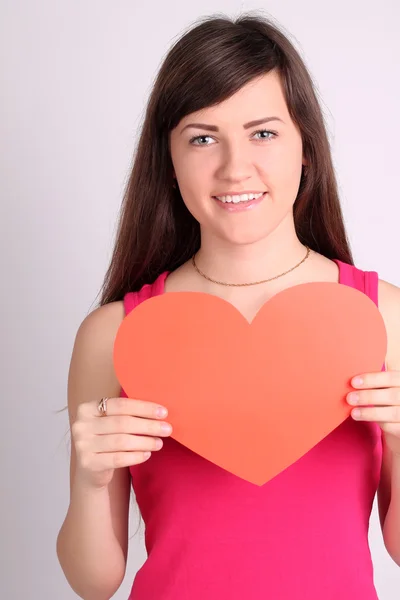 Mädchen mit einer Herzform — Stockfoto