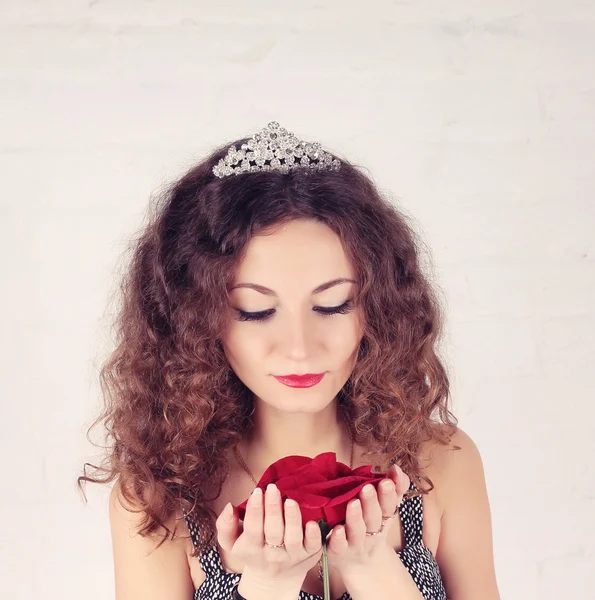 Beautiful girl with big red flower — 스톡 사진