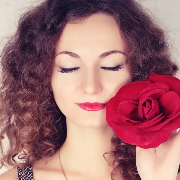 Beautiful girl with big red flower — Stock Photo, Image