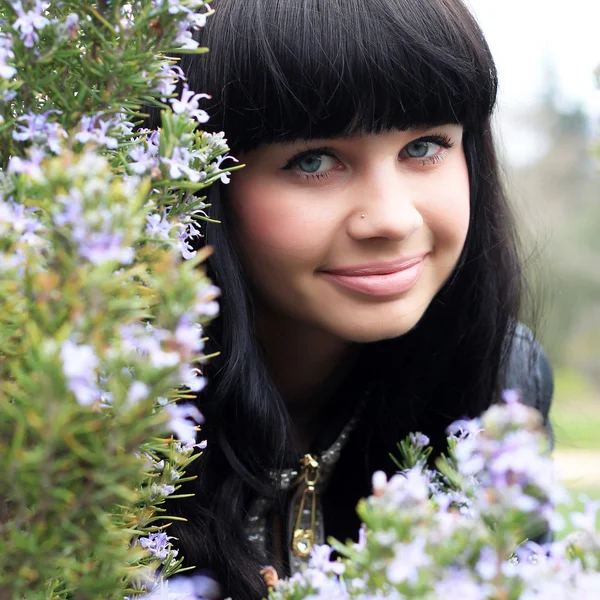 Beautiful girl in the field of rosemary — Stock Photo, Image