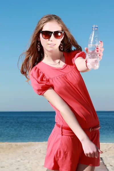 Girl drinking water outdoor — Stock Photo, Image