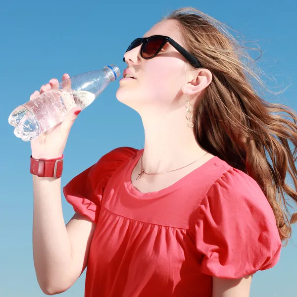 Girl drinking water outdoor — Stock Photo, Image