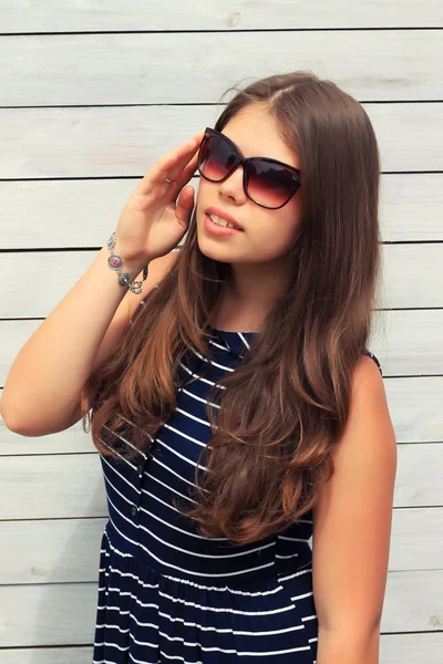 Young girl Teenager with a wooden fence — Stock Photo, Image