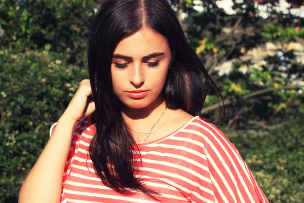 Brunette girl in an urban style — Stock Photo, Image