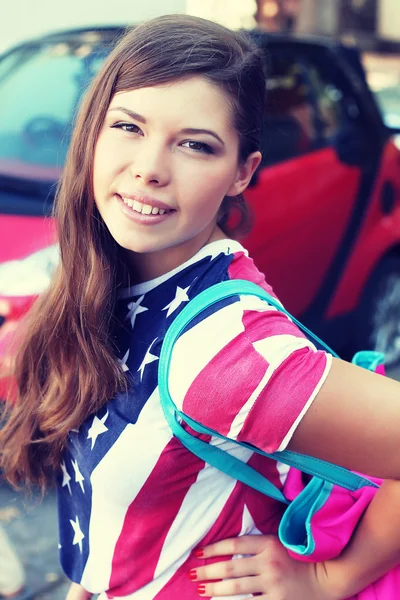 Pretty American girl in American flag t-shirt. — Stock Photo, Image