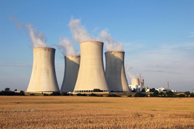 Cooling tower of nuclear power plant and agriculture field clipart