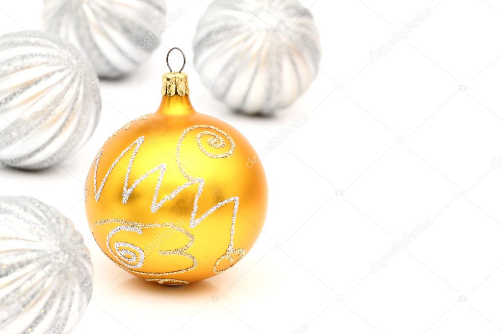One yellow and silver christmas ball on white