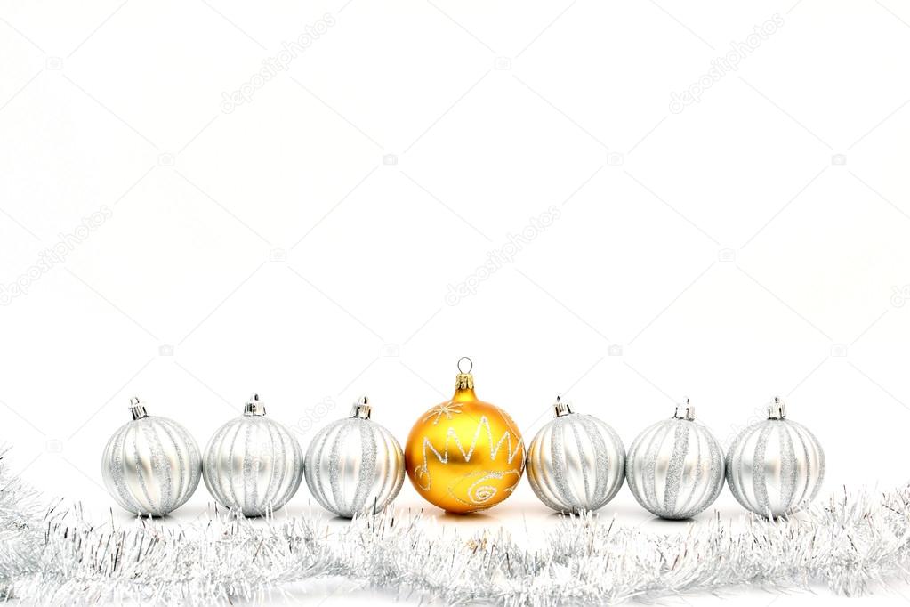Golden christmas ball and silver balls in row