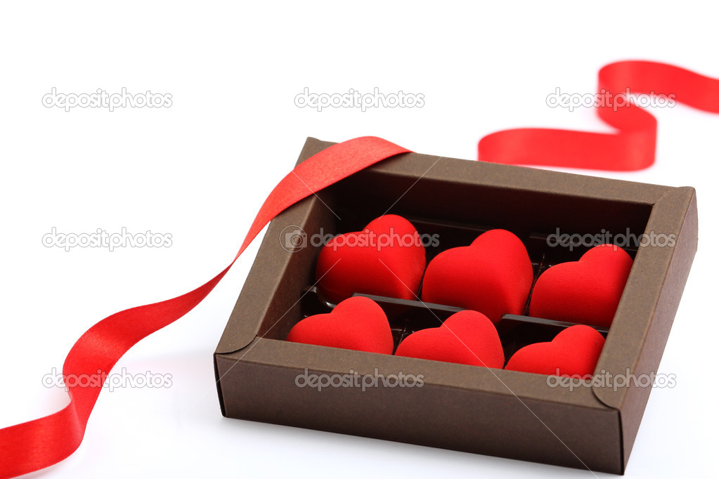 Red hearts in brown box on white background