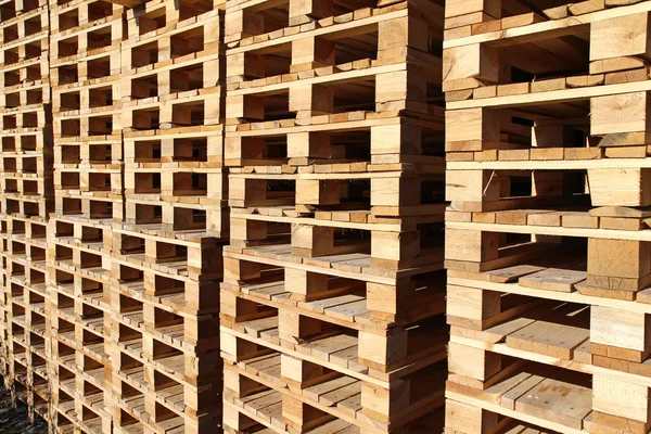 Detail of stock wood pallet under sun light — Stock Photo, Image