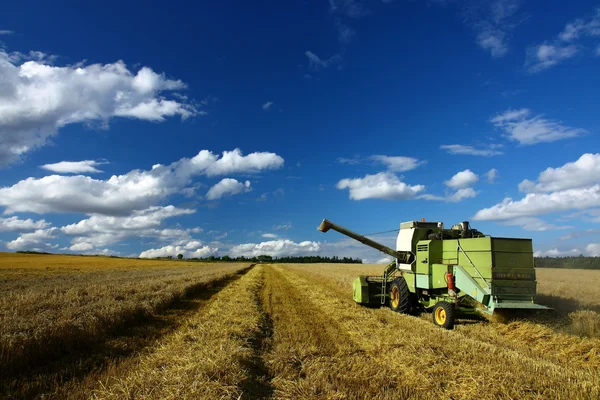 Machinery working o the agriculture field Stock Photo