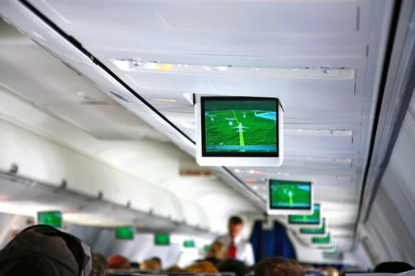 Interior of airplane with telescreens — Stock Photo, Image