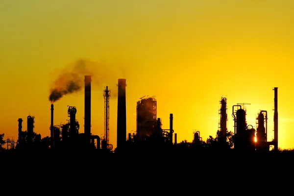 Black silhouette of big crude oil refinery from Russia Stock Photo
