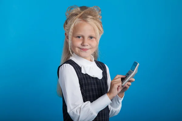 Schoolgirl with a calculator — Stock Photo, Image